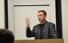 Rick Kupchella with arm raised, is speaking at Minnesota Blogger Conference